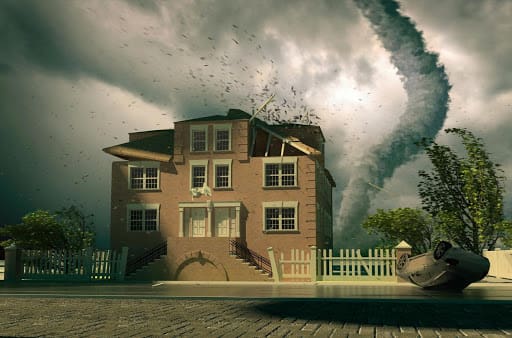 A Tornado rips the roofing off of a home