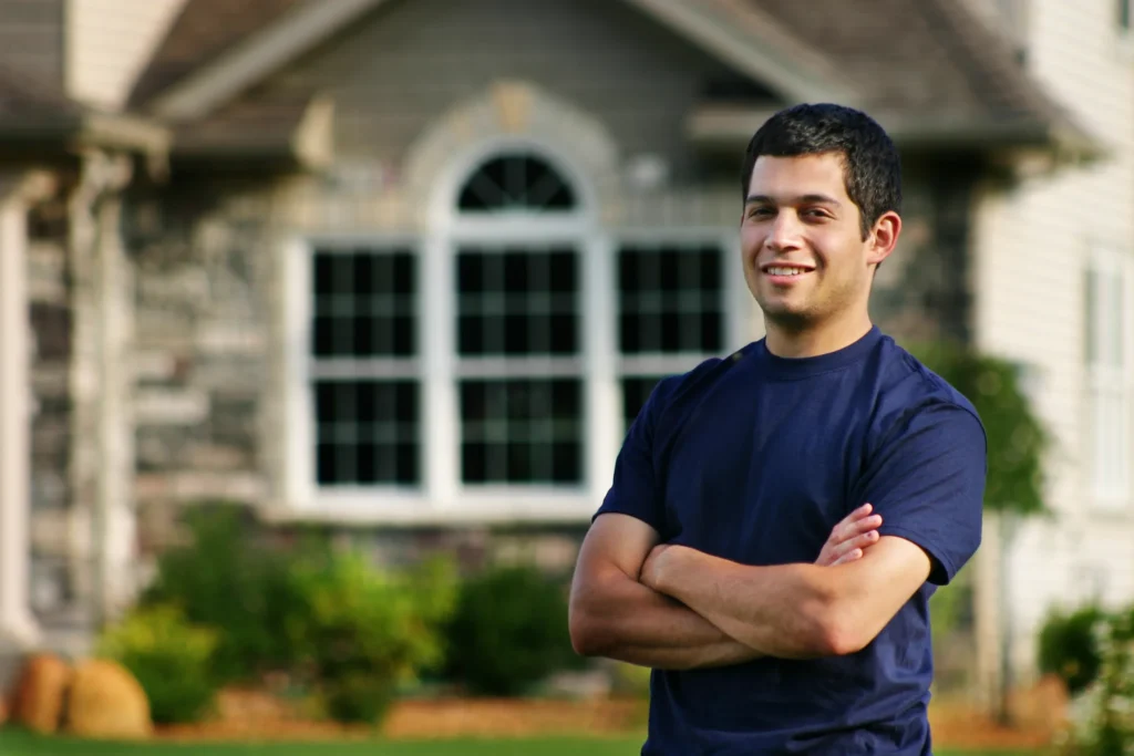 homeowner standing outside his house